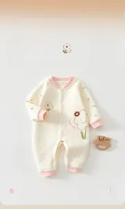 Detailed close-up of quilted thermal infant romper with Class A safety standard and snap buttons