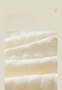 Close-up of soft quilted fabric with diamond pattern for baby thermal sleepwear
