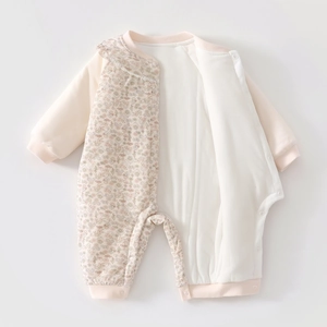 Detailed view of baby floral cotton romper featuring front buttons and frilled neckline