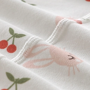 Soft organic cotton newborn jumpsuit with pink bunny and cherry prints for infants