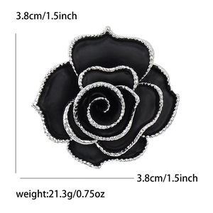 Élégante broche fleur de camélia noir avec bords argentés pour costumes et pulls