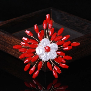 Handcrafted red crystal flower brooch with pearls on an elegant gold metallic wire