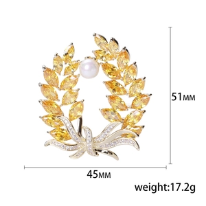 Elegant gold wheat brooch with yellow stones and pearl details, 51mm by 45mm size