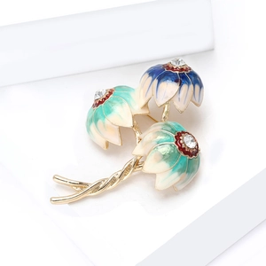 Detailed macro view of retro enamel flower brooch with rhinestones on white display box