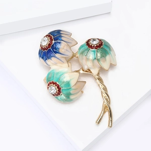 Detail of three-flower brooch with blue enamel petals and sparkling crystal centers