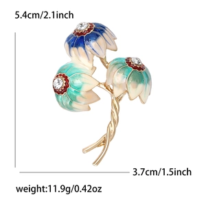 Vintage tulip brooch with blue and green enamel and white rhinestones in gold setting
