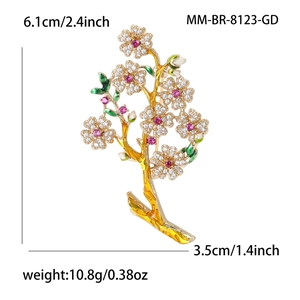 Broche branche de fleur dorée élégante avec zircons et pierres roses, hauteur 6,1 cm