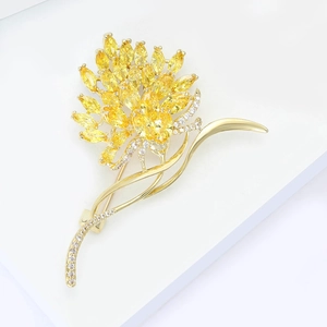Elegant gold flower brooch with yellow marquise zircon petals and sparkling white accents