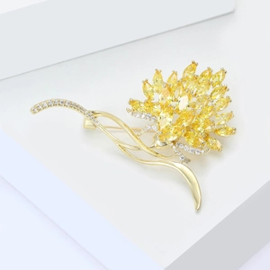 Elegant gold flower brooch with yellow zircon crystals for luxury coats and evening dresses