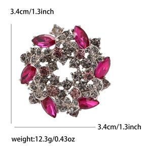 Vintage alloy wreath brooch with pink rhinestones and crystals on white background