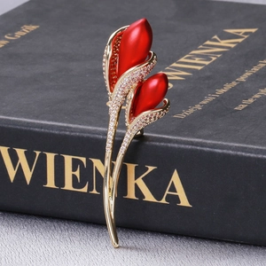 Detailed close-up of luxury tulip brooch with red petals and white zircon inlay