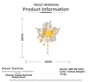 Detailed view of flower brooch with amber zircon tassels showing 66mm by 48mm dimensions