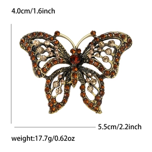 Exquisite golden butterfly brooch with amber rhinestones measuring 4.0cm by 5.5cm