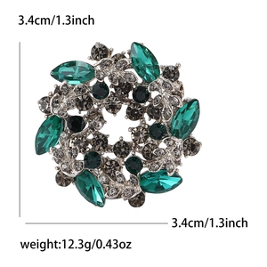 Retro emerald glass flower brooch with rhinestones in vintage alloy silver finish