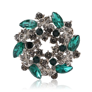 Vintage crystal flower wreath brooch with emerald marquise stones on silver alloy base