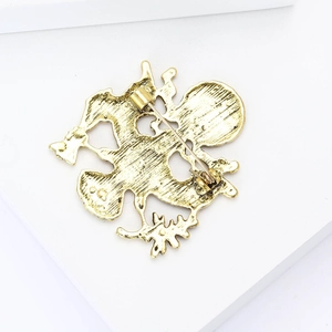 Macro shot of the golden alloy eagle badge brooch back side with secure pin fastening