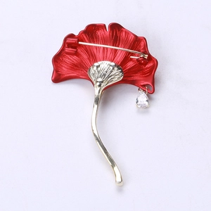 Detail view of ginkgo leaf brooch back with secure pin clasp and drop zircon pendant