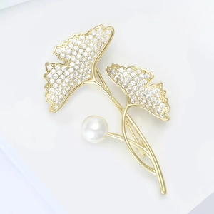 Elegant gold ginkgo leaf brooch with shimmering cubic zirconia and a white pearl accent