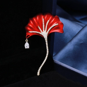Detail of red ginkgo leaf brooch with pavé zircon and water drop crystal pendant