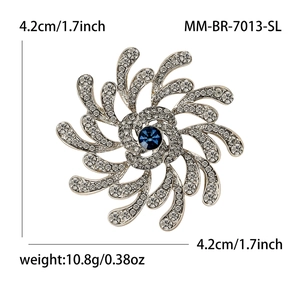 Broche fleur étincelante avec centre en cristal bleu et placage argent pour revers