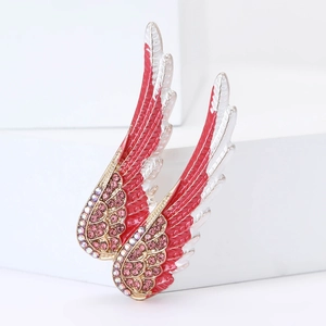 Détail de broche ailes d'ange en alliage avec gouttes d'huile et strass roses