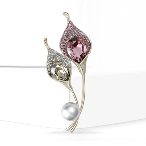 Elegant crystal floral brooch with pink rhinestones and a white pearl in silver setting