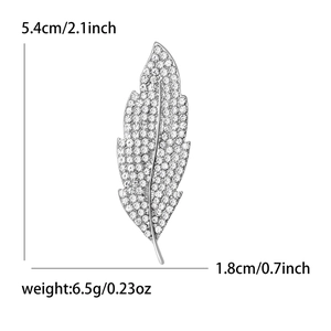Elegant leaf brooch with sparkling crystals in silver finish, size 5.4cm by 1.8cm