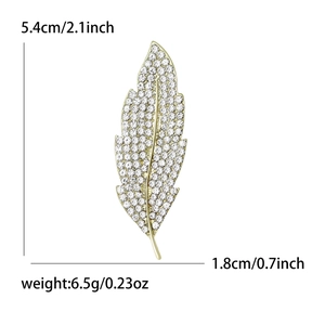 Luxurious gold leaf brooch with sparkling crystals, sized 5.4cm by 1.8cm, weighing 6.5g