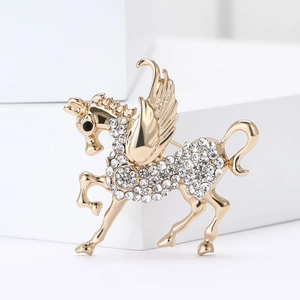Sparkling crystal Pegasus brooch in gold finish for suits and coats, elegant jewelry