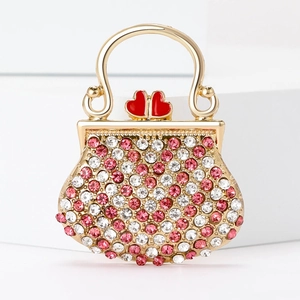 Broche sac à main avec strass brillants et cœurs rouges sur cadre doré chic