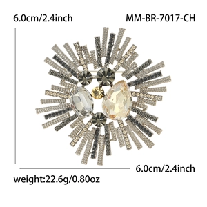 Broche baroque fleur de soleil en cristal avec pierres gouttes et rayons en strass