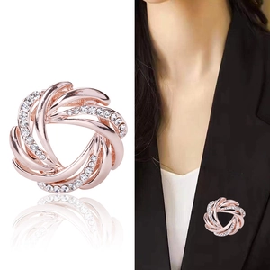Sparkling rhinestone flower brooch in rose gold with elegant spiral zircon design