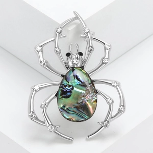Vintage spider brooch with abalone shell and white rhinestones on silver metal