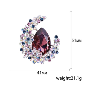 Elegant silver crescent brooch with purple teardrop crystal and colorful rhinestones