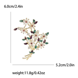 Broche bouquet de marguerites élégante en or avec pierres de zircone et détails en émail