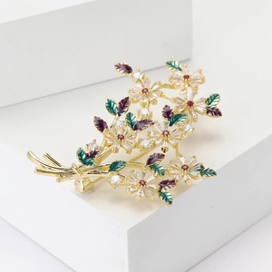 Broche bouquet de marguerites en cuivre et zircon avec finition dorée et cristaux colorés