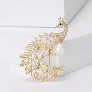 Luxurious gold peacock brooch with micro-pave zircons and elegant white pearl detail