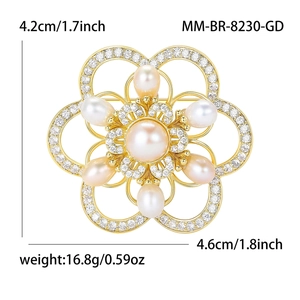 Elegant gold camellia brooch with large central pearl and sparkling zircon petals