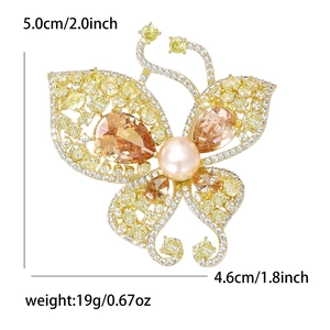 Luxury butterfly brooch with yellow crystals and pink pearl in gold hollow design