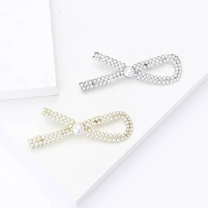 Elegant pearl bow brooch set with vintage gold and silver metal finish for women's suits