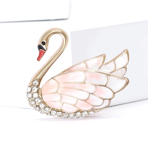 Elegant gold-tone swan brooch with pink enamel wings and sparkling crystal details