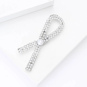 Elegant Korean style bow brooch with white pearls and silver alloy finish for women