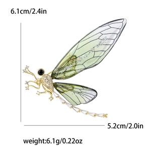 Detailed dimensions of a dragonfly brooch with green wings and clear zircons, 6.1cm by 5.2cm