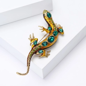 Broche lézard dorée de luxe avec pierres précieuses vert émeraude et émail ambre