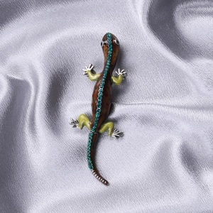 Detail view of gecko brooch with brown enamel, teal rhinestones on silver-tone alloy