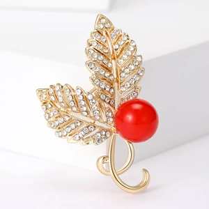 Elegant gold leaf brooch with micro-pave zircons and a large red round pearl accent