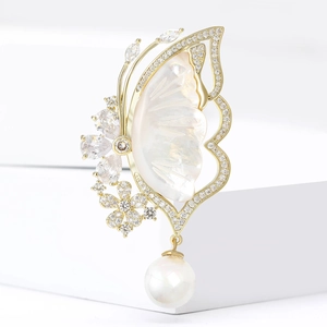 Luxury copper butterfly brooch with shell wings, zircon accents and hanging pearl drop
