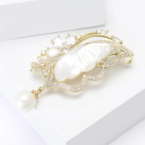 Luxury butterfly brooch with copper zircon shell and a hanging pearl drop pendant