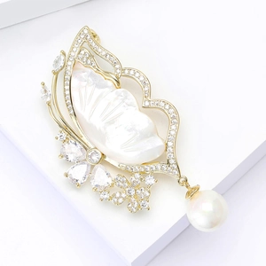 Luxury butterfly brooch with mother of pearl wings, clear zircons and a white pearl drop