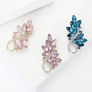 Elegant crystal leaf brooch pins in pink, purple, and blue with gold and silver finish